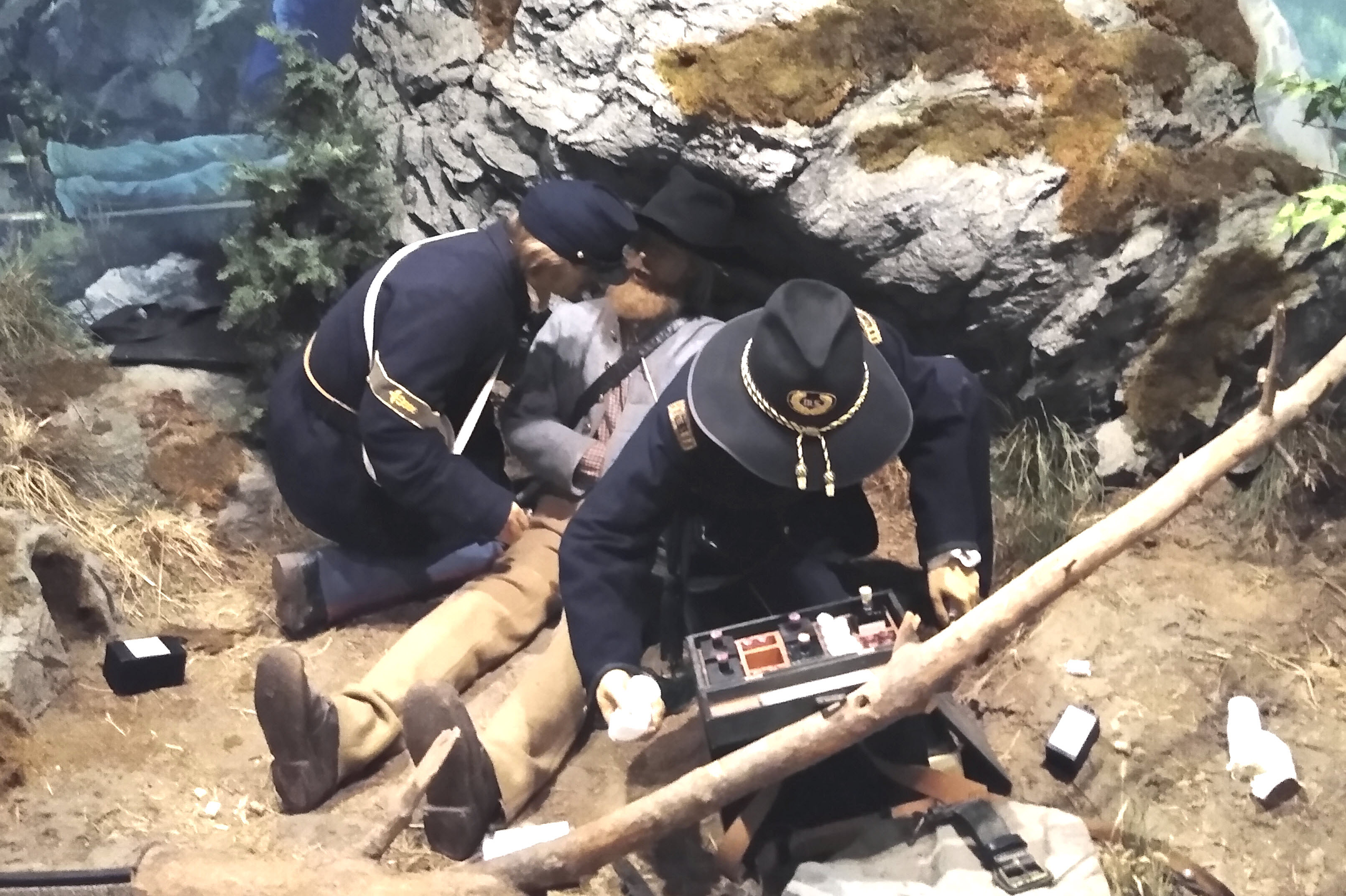 Assistant surgeon and hospital steward treating Confederate soldier